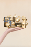 Orbs gold clutch