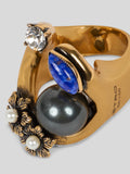 Ring with appliqués