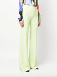 flared light-green trousers